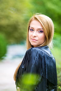 woman wearing black leather fringed top thumbnail