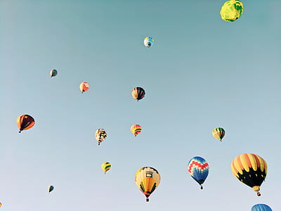 assorted-color hot air balloon on sky thumbnail