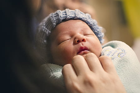 shallow focus photography of newborn baby thumbnail