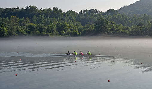 four persons riding boat thumbnail