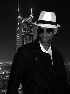 grayscale photo of man wearing fedora hat thumbnail