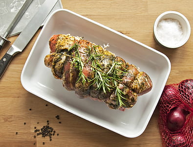 roasted chicken on tray beside knife thumbnail