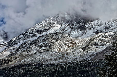 snow covered mountain during daytime thumbnail