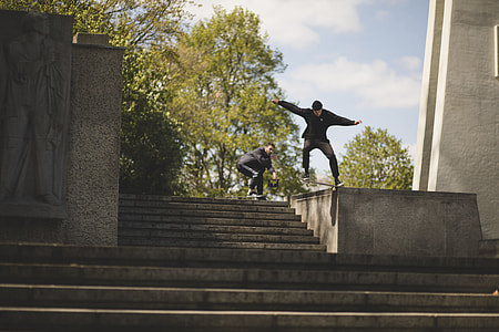 two men skateboarding on stair thumbnail