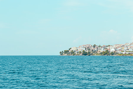 body of water beside village thumbnail