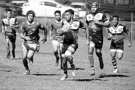 grayscale photography of rugby game thumbnail