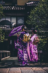 two woman walking on a pathway thumbnail