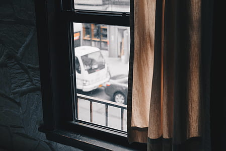 brown window curtain during daytime thumbnail