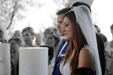 photo of man in blue notched lapel suit jacket and woman in white wedding gown thumbnail
