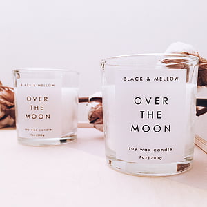 selective focus photographyof two Over the Moon votive candles thumbnail