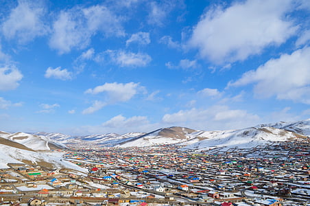 aerial view of houses beside mountain thumbnail