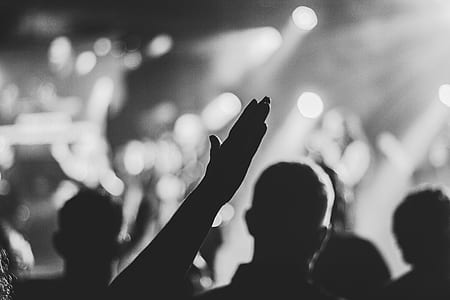 grayscale photography of person waving his hand thumbnail