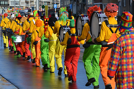 clown street marching band between buildings thumbnail