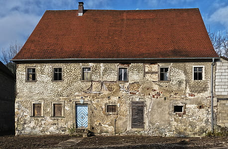 gray concrete house with brown roof thumbnail