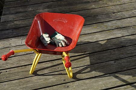 red and yellow wheelbarrow toy thumbnail