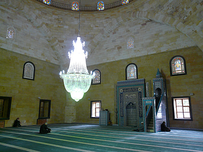 clear glass chandelier inside building near altar thumbnail