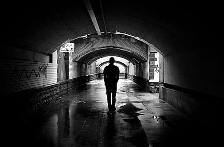Silhouette Photo of a Man in a Tunnel thumbnail