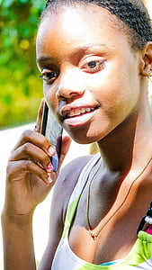 selective focus photo of woman holding smartphone thumbnail