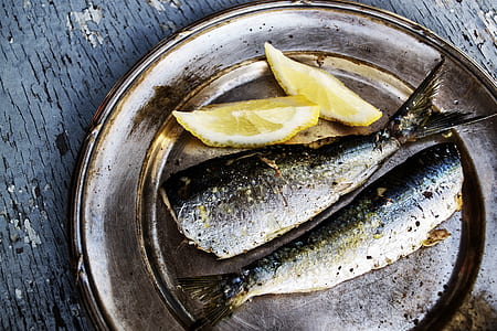 dried fish with lemons on plate thumbnail