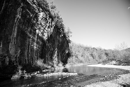 Monochrome photo of current river and cliff at Echo Bluff State Park, Missouri thumbnail