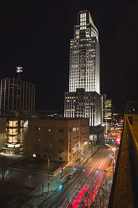 time lapse photography of road beside buildings thumbnail