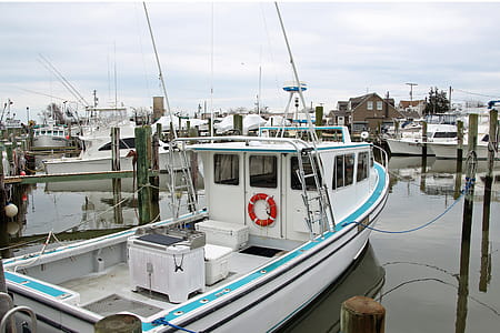 Small fishing boat moored at a dock in Point Pleasant New Jersey. thumbnail