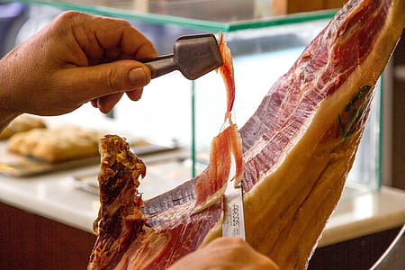 person cutting meat thumbnail