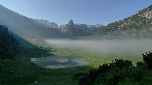 landscape photography of grass field with mountain thumbnail