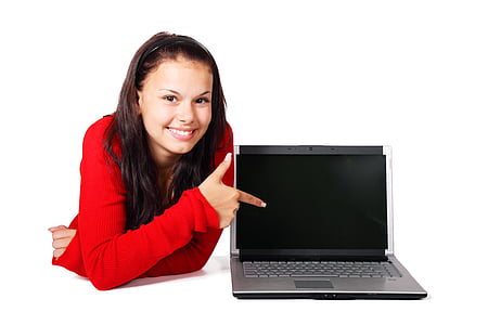 black and gray laptop computer beside girl wearing red long-sleeved shirt thumbnail