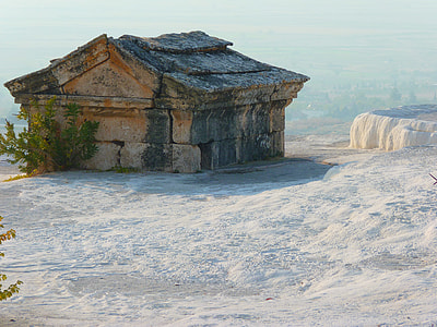 brown stone house on white hill thumbnail