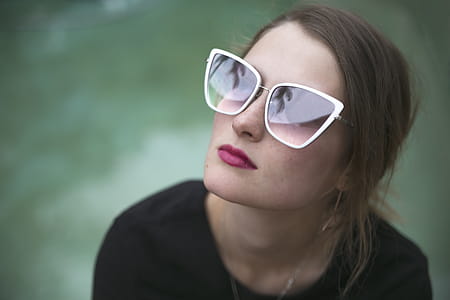 Woman Wearing Gray Framed Butterfly Sunglasses thumbnail