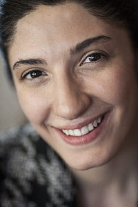 woman wearing black and gray top thumbnail