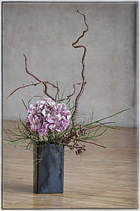 pink hydrangeas in black vase centerpiece thumbnail