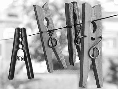 grayscale photography of clothes clips thumbnail
