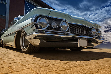 selective focus photography green muscle car thumbnail