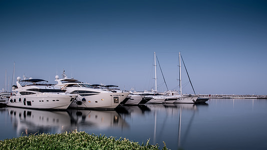 white yacht on body of water thumbnail