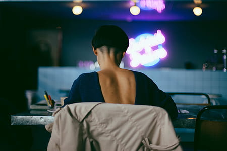 woman sitting on chair in front of table thumbnail