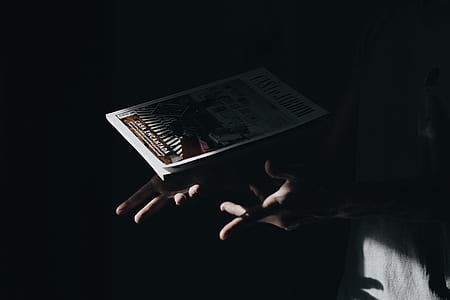 person holding book thumbnail