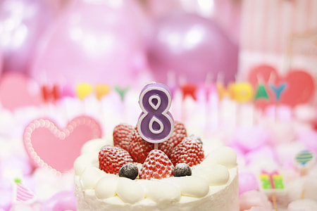 strawberry-filled cake with purple and white 8 candle thumbnail