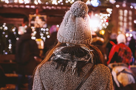 Girl from back on background illumination glow bokeh light in night thumbnail