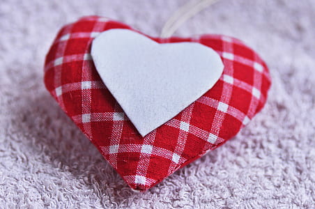 close-up photo of white and red plaid heart pillow thumbnail