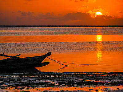 boat under sunset photography thumbnail
