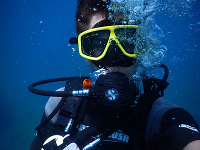 person wearing scuba diving suit underwater thumbnail