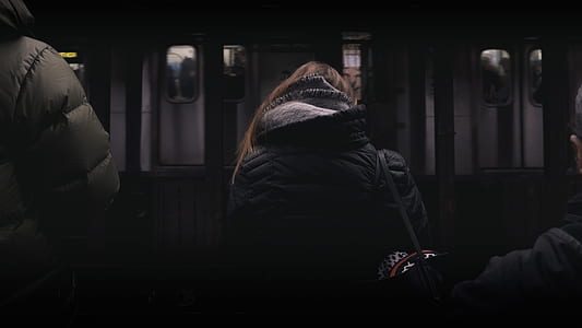 woman sitting in front of train station thumbnail