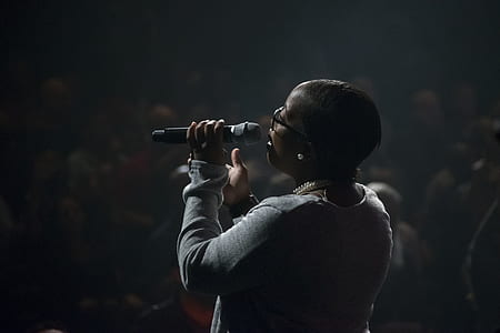 person singing before audience thumbnail