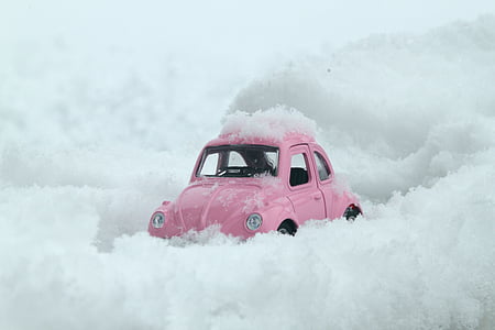 pink Volkswagen Beetle on snow land thumbnail