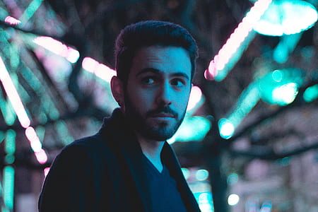 selective focus photo of man wearing black top thumbnail
