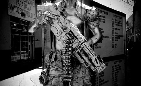 Photography of Human Holding Gun thumbnail