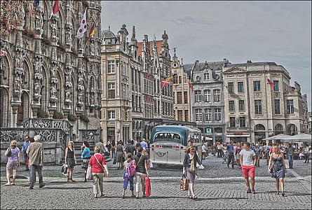 group of person walking on the street near building thumbnail