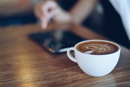 focus photo of cappuccino on table thumbnail